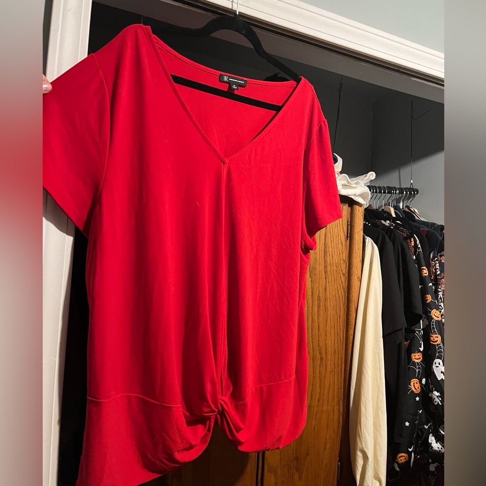 Red blouse with knot detailing at bottom